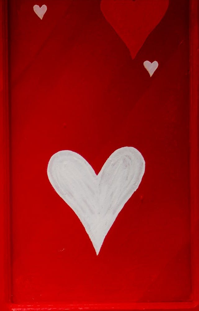 red wooden door with heart shaped white heart shaped red wooden door with heart shaped white heart shaped