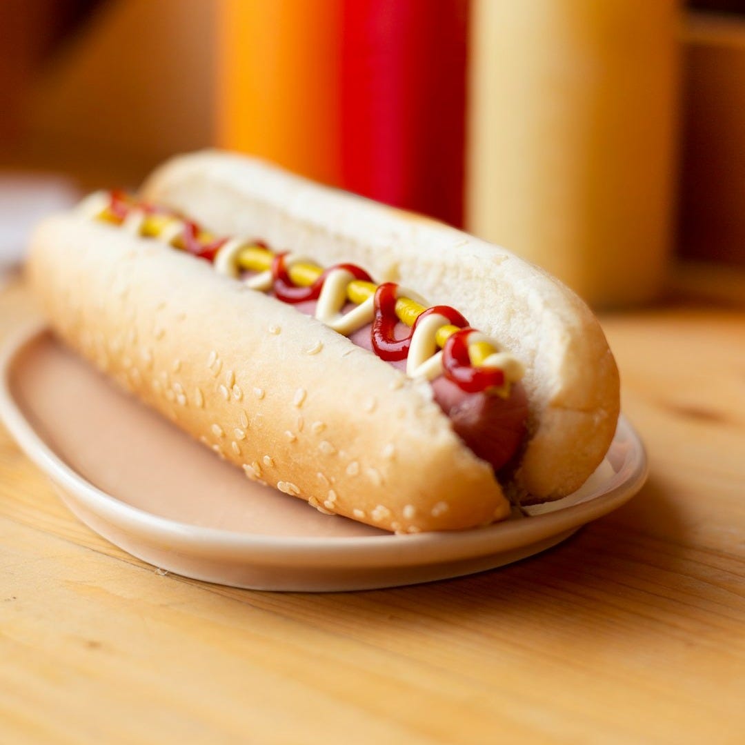 hotdog sandwich on white plate