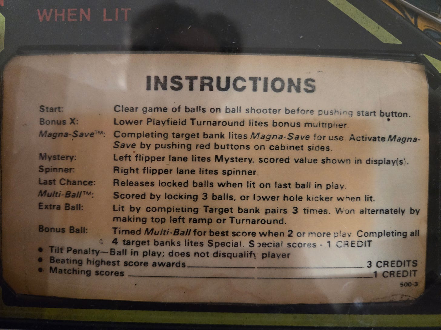 Original Black Knight (1980) coin door instruction card showing pricing (25 cents, 3 balls per game) and scoring rules Original Black Knight (1980) coin door instruction card showing pricing (25 cents, 3 balls per game) and scoring rules