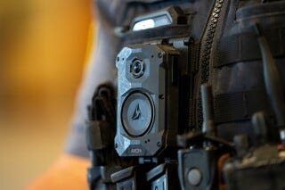 An Axon body camera is worn by MSGT Matt Gilmore who is one of the officers using Axon's Draft One AI software at OKCPD headquarters on Friday, May 31, 2024 in Oklahoma City, Oklahoma. (AP Photo/Nick Oxford, File) An Axon body camera is worn by MSGT Matt Gilmore who is one of the officers using Axon's Draft One AI software at OKCPD headquarters on Friday, May 31, 2024 in Oklahoma City, Oklahoma. (AP Photo/Nick Oxford, File)