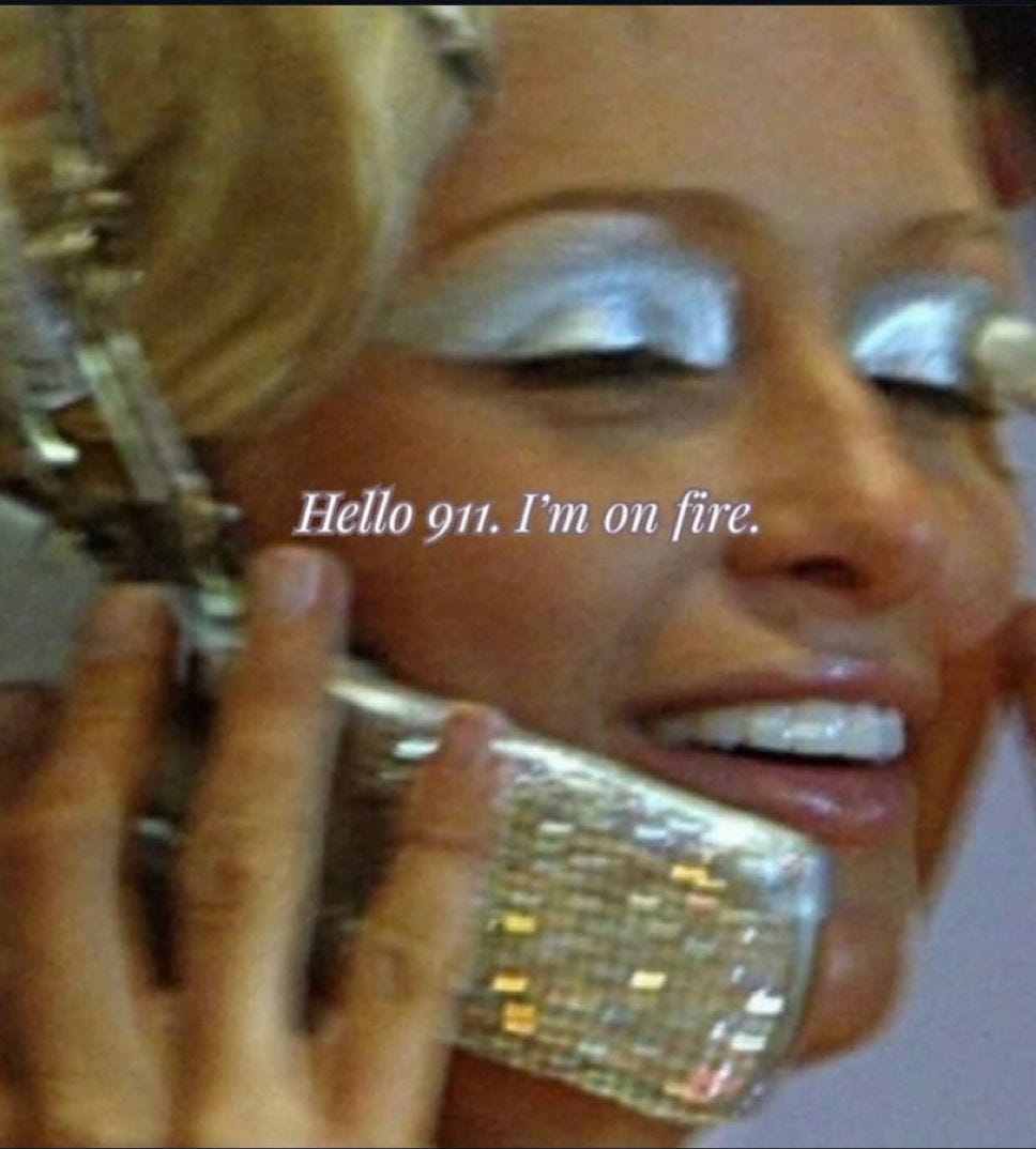 hello 911 I'm on fire - paris hilton with her glittery phone thriving hello 911 I'm on fire - paris hilton with her glittery phone thriving