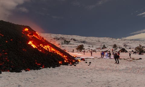 A crowd of tourists gathers to witness the recent eruptions of Mount Etna.