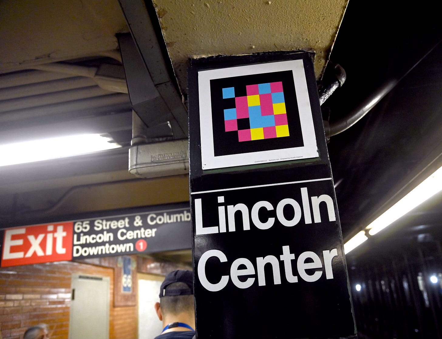 Photo showing a Navilens tag on a column at Lincoln Center on NYC Subway. Photo showing a Navilens tag on a column at Lincoln Center on NYC Subway.