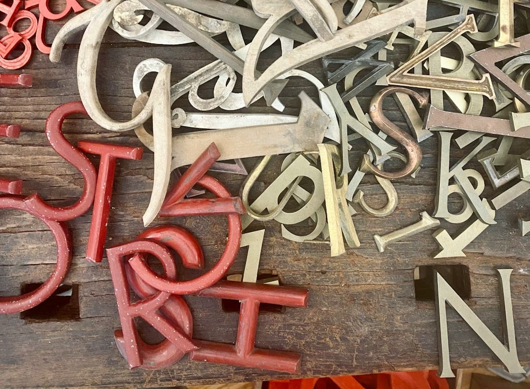 a wooden table topped with lots of different types of scissors a wooden table topped with lots of different types of scissors