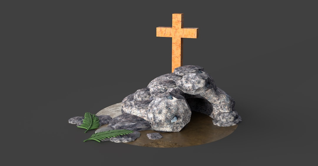 gray stone cross on brown wooden round table gray stone cross on brown wooden round table