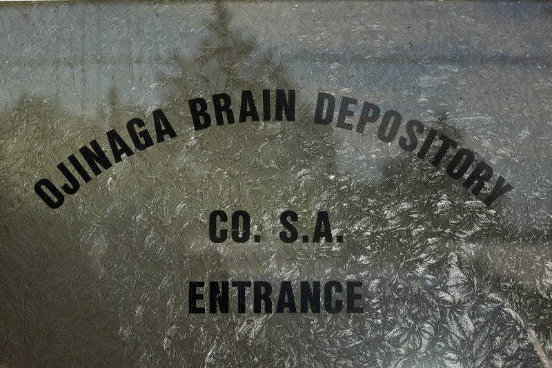 A close-up of a sign on a window

Description automatically generated