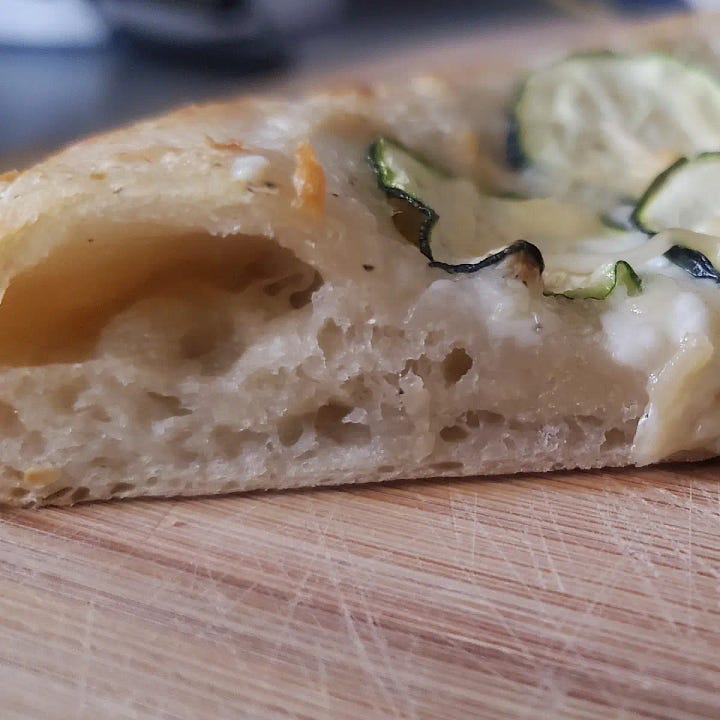 Zucchini Pizza from Cleveland cooking. Garlic cream sauce topped with sliced zucchini.