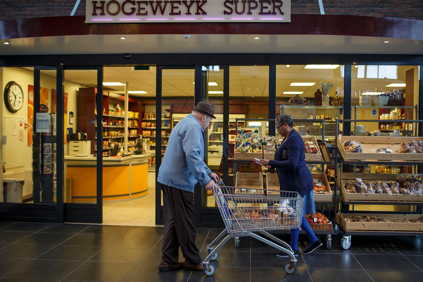 The exterior of the "Hogeweyk Super," the on-campus and operating grocery store, with shelves and register and carts in use. The exterior of the "Hogeweyk Super," the on-campus and operating grocery store, with shelves and register and carts in use.