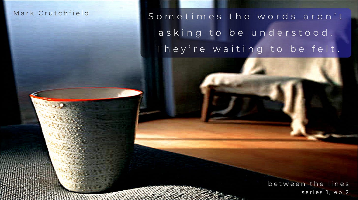 A softly lit room with a window ajar, mist drifting in and a faint breath-fog on the glass. An empty chair faces away beside folded linen, bathed in golden grey light. The scene evokes the moment after release, after being held, when silence feels like presence. Created by Mark Crutchfield | Part of a series called Between The Lines.”