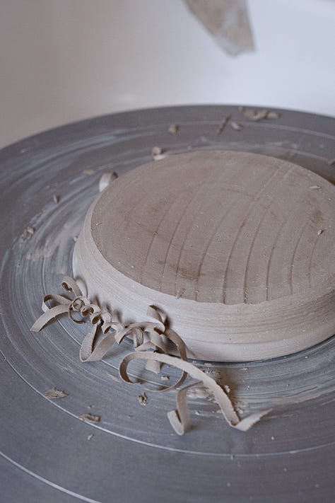 Five images of clay in varying states, ready to use, dried up slip in a pot, on a slab being recycled and curls of leather hard clay from a turned saucer
