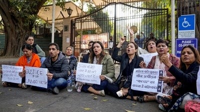 New Delhi: Agitators, including women activists, stage a protest against the suspension of the jail term of Kuldeep Sengar, a former BJP MLA who was convicted in the Unnao rape case, outside the Delhi High Court, in New Delhi, Friday, Dec. 26, 2025. (PTI) New Delhi: Agitators, including women activists, stage a protest against the suspension of the jail term of Kuldeep Sengar, a former BJP MLA who was convicted in the Unnao rape case, outside the Delhi High Court, in New Delhi, Friday, Dec. 26, 2025. (PTI)