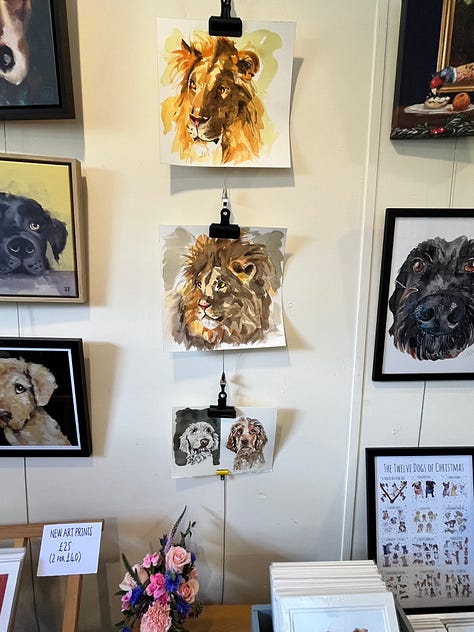 Photo of Dog portraits hung on the wall of the artist Jo Scotts Studio