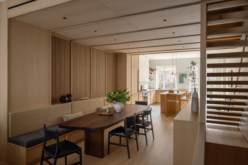 Large dining area with built-in bench and walnut table