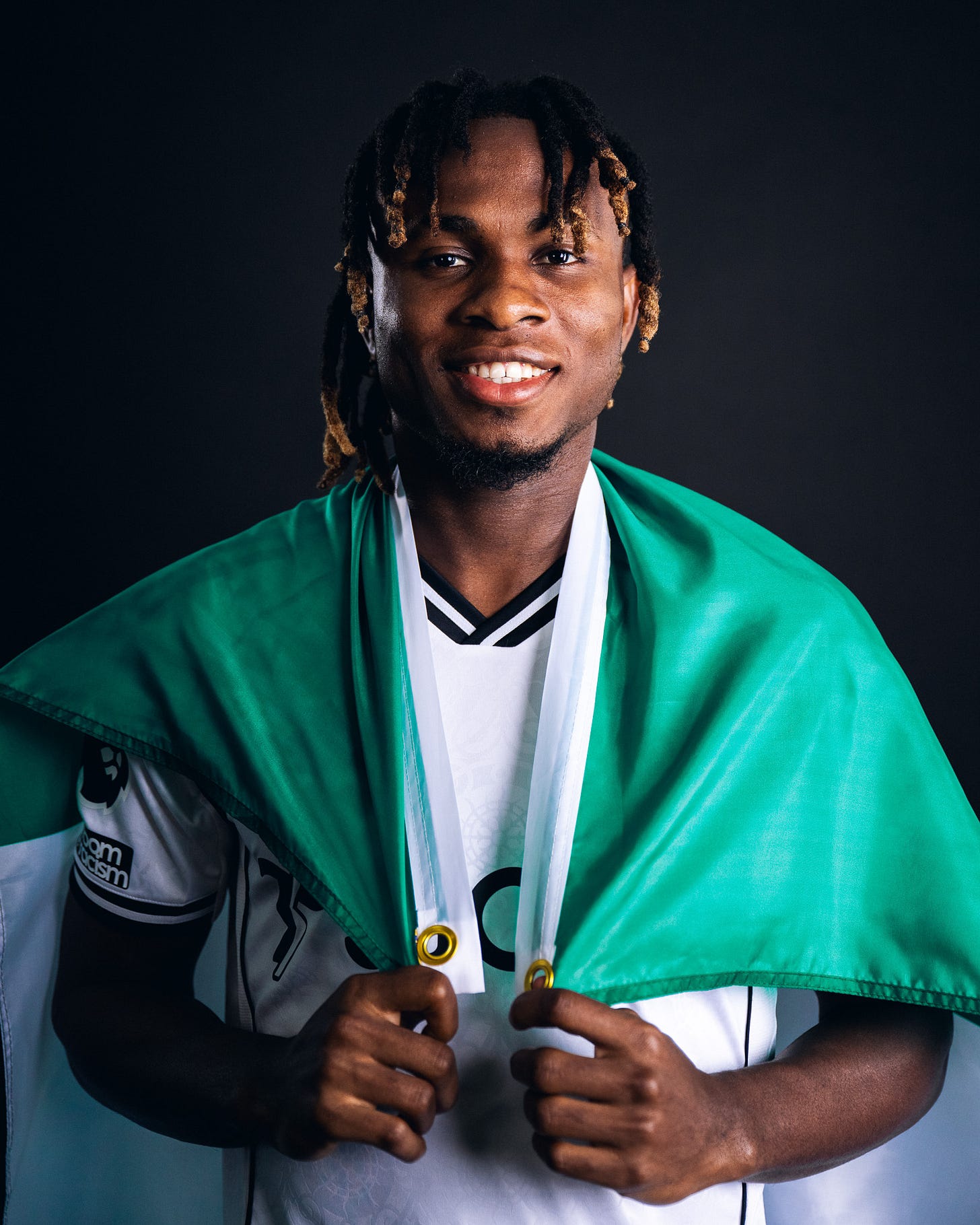 Samuel Chukwueze with a Nigeria flag.