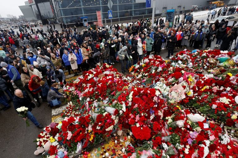 People gather at a makeshift memorial to the victims of a shooting attack set up outside the Crocus City Hall concert venue in the Moscow Region, Russia, March 24, 2024. REUTERS/Maxim Shemetov People gather at a makeshift memorial to the victims of a shooting attack set up outside the Crocus City Hall concert venue in the Moscow Region, Russia, March 24, 2024. REUTERS/Maxim Shemetov