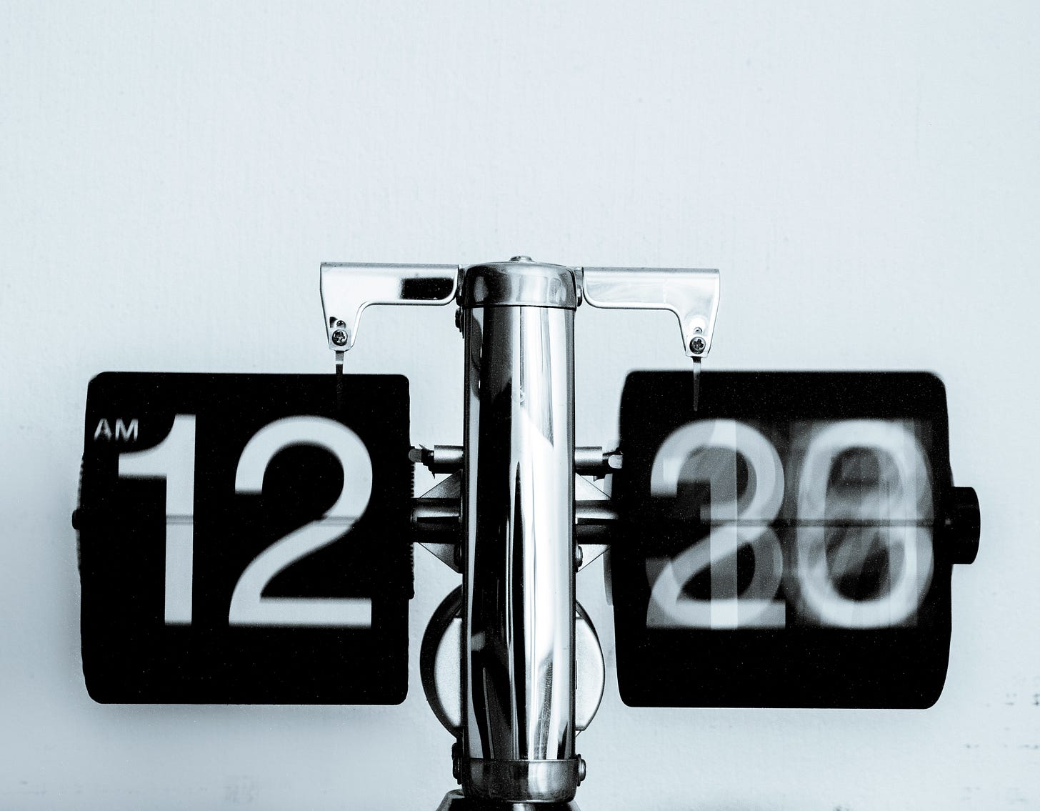 a clock with a slow shutter, making the time blurry, giving the effect of it moving by quickly