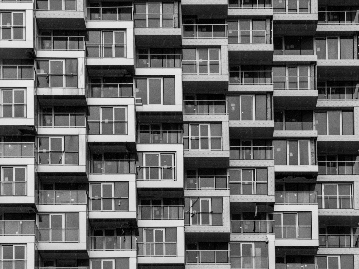 white and black concrete building white and black concrete building