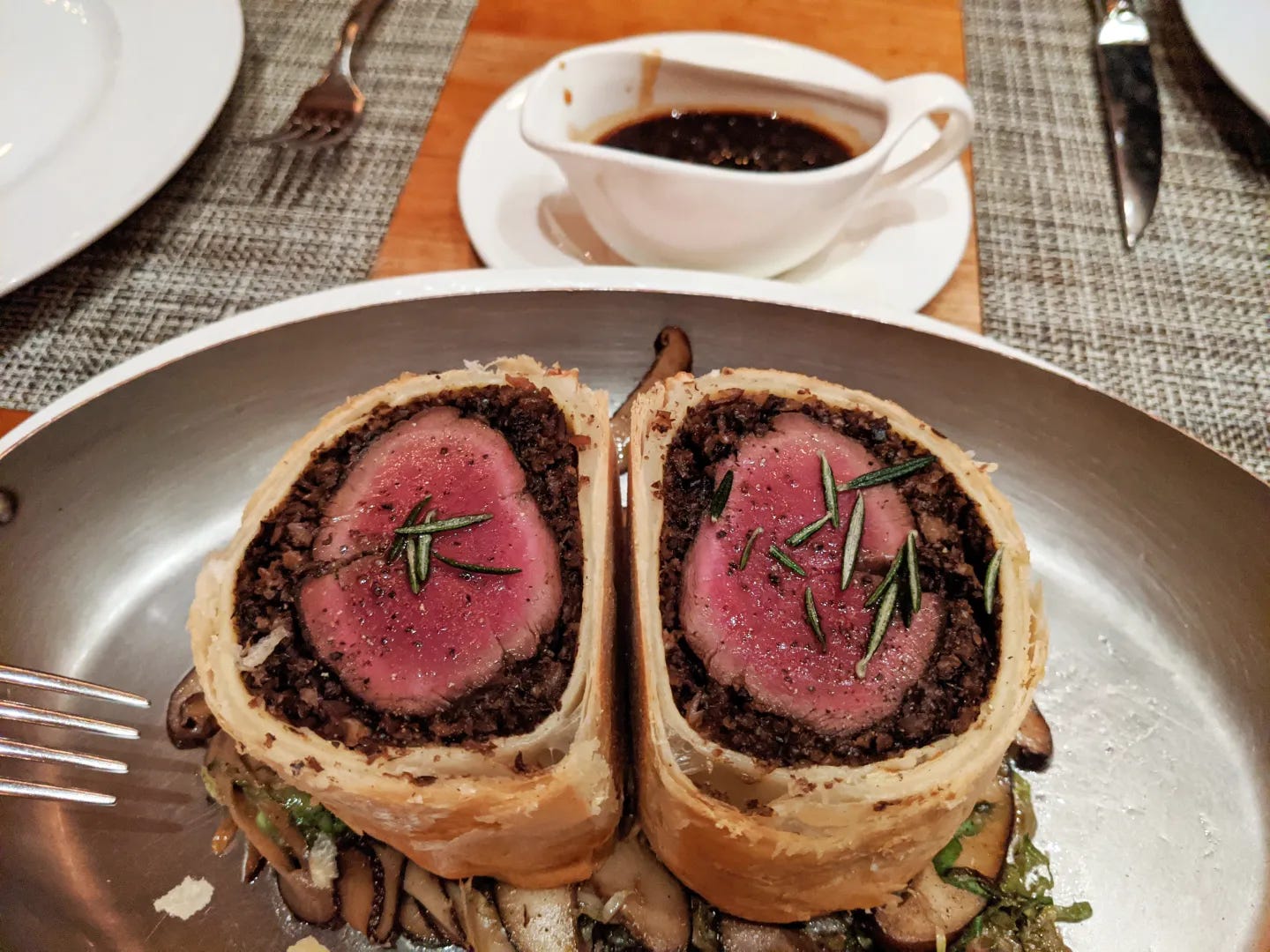 A halved beef dish with a pastry dough shell.