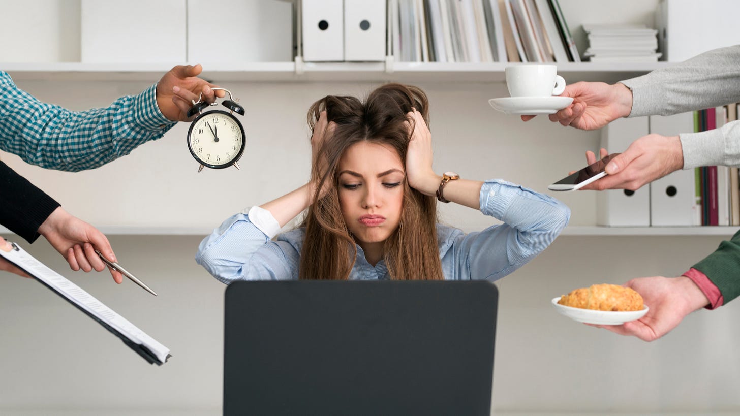 Overwhelmed professional surrounded by multiple demands, including a clock, phone, coffee, and paperwork—symbolizing workplace pressure and the need for leadership transformation.