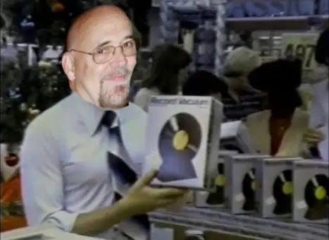 Terry Trueman Holding the Ronco Record Cleaner