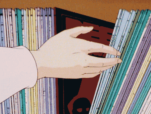 This may contain: a hand reaching for a stack of records