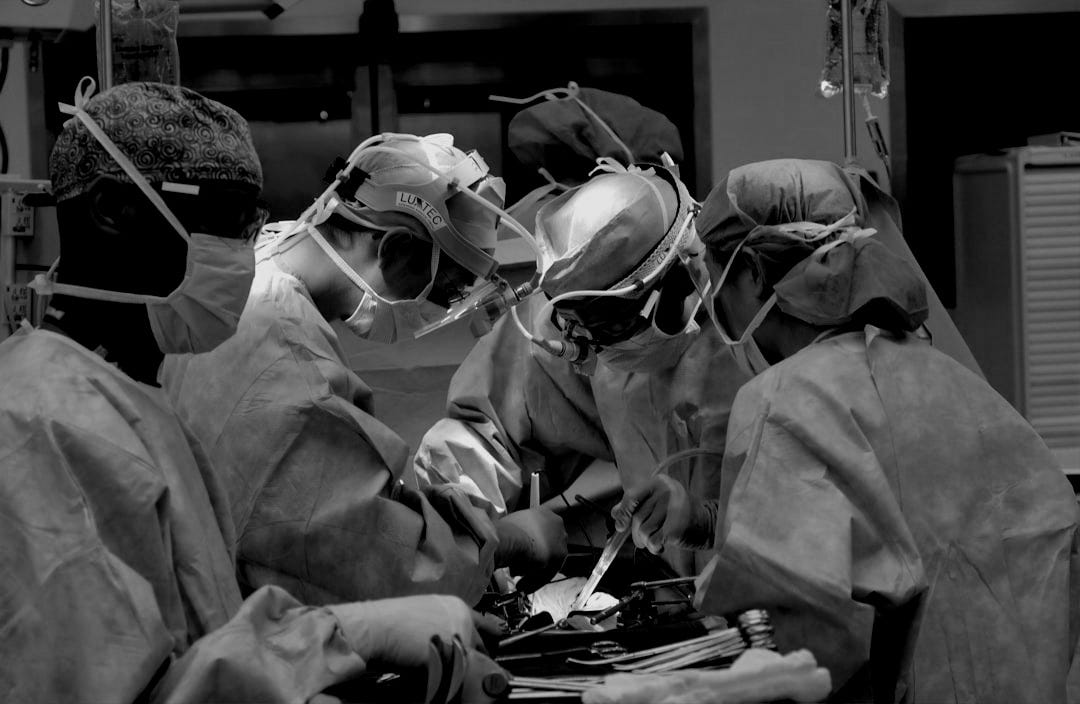 man in white dress shirt wearing white goggles