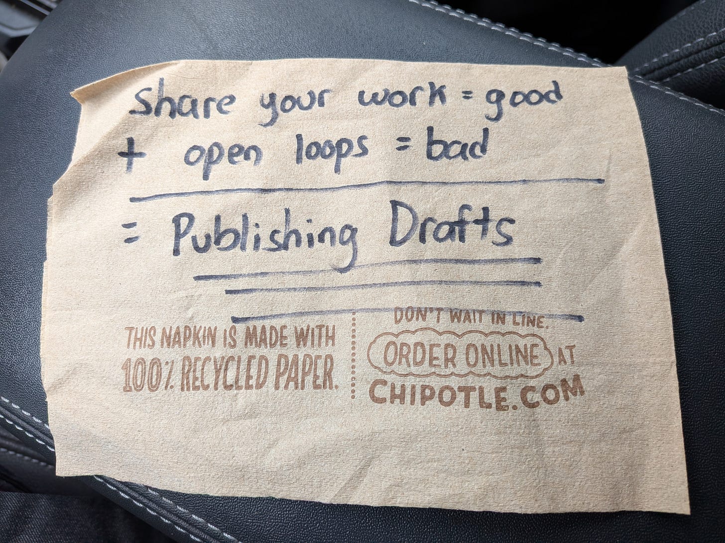 Chipotle napkin with sharpie writing about publishing drafts.