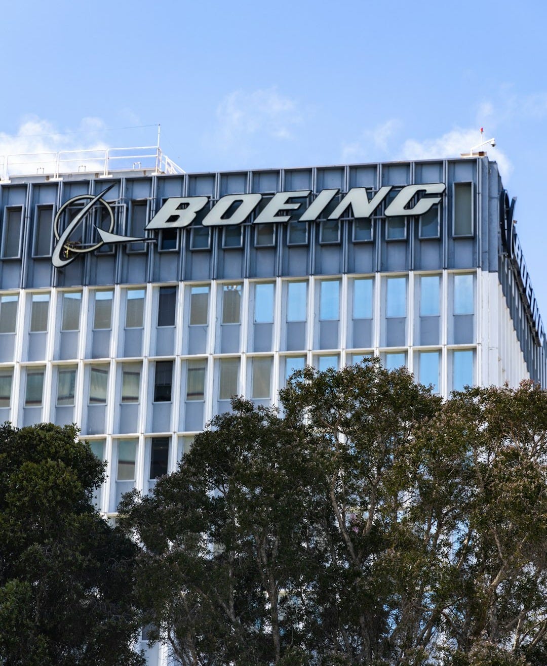 a tall building with a sign on top of it