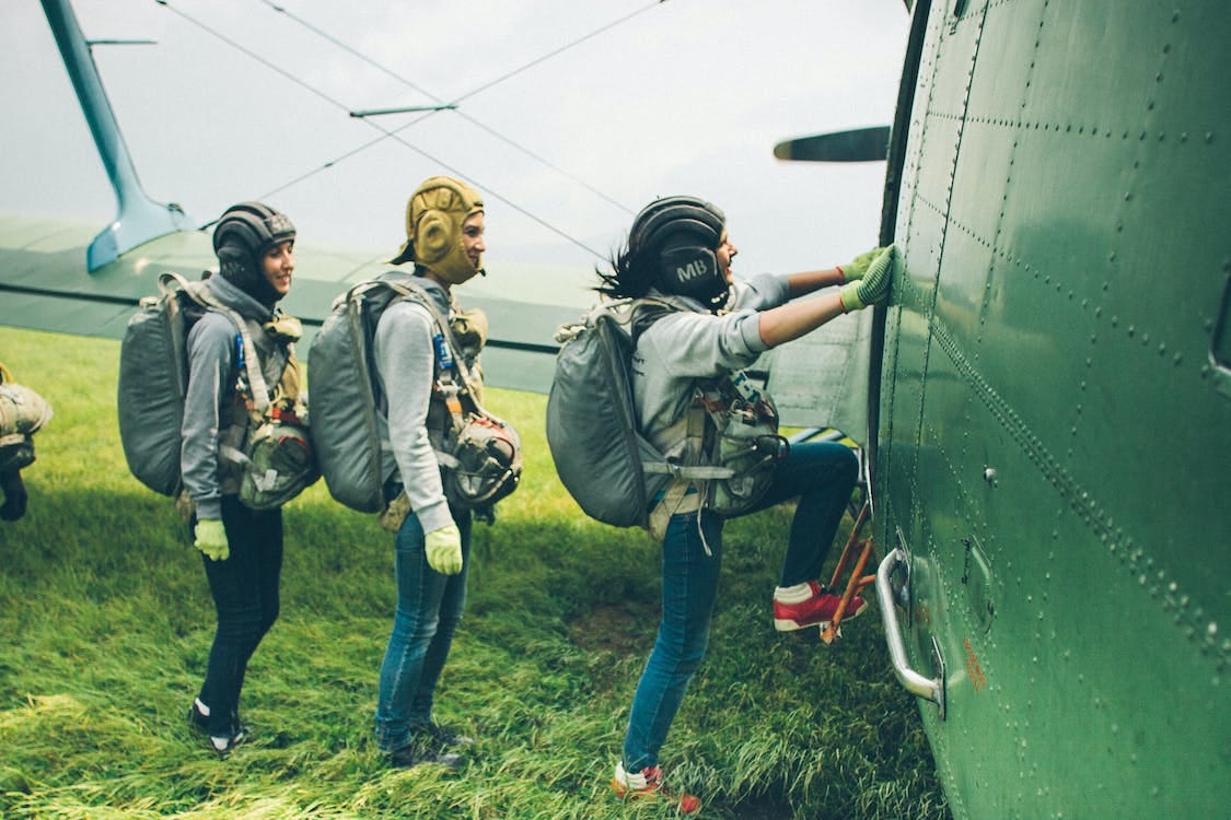 Free Smiling Skydivers Boarding into Plane Stock Photo Free Smiling Skydivers Boarding into Plane Stock Photo