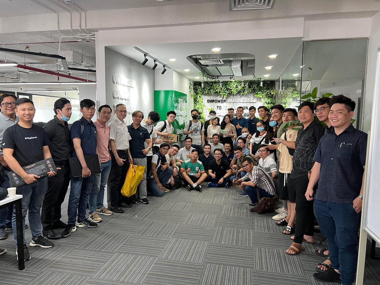 May be an image of 7 people, people standing, people sitting and indoor