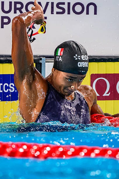 Sara Curtis of Italy reacts after setting a new world record in the swimming 50m Backstroke Women Semifinal during the European Aquatics...
