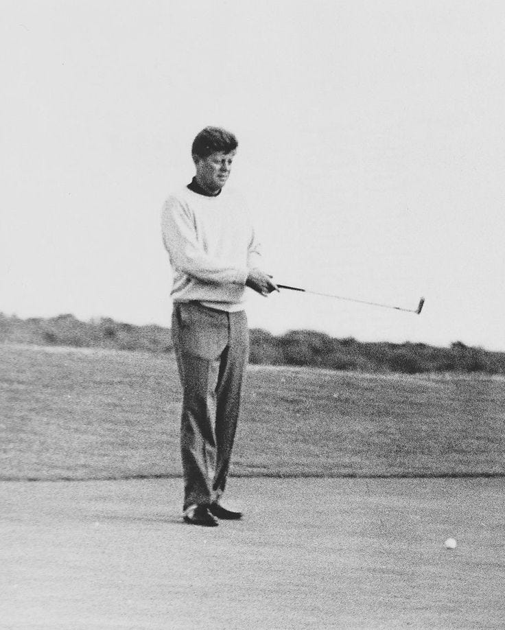 This may contain: black and white photograph of a man playing golf