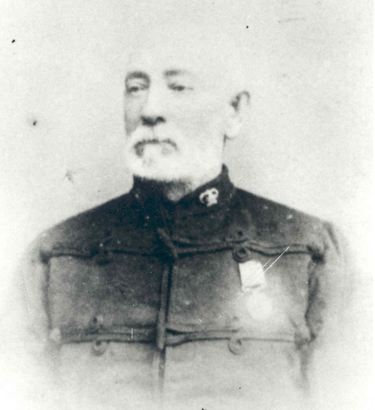 An older man dressed in police uniform.