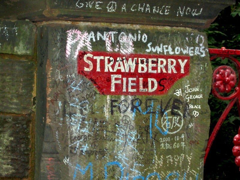 A 2002 image of the Strawberry Field’s gatepost, covered in Beatles fans’ writing, and messages.