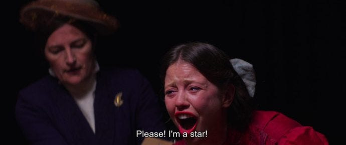 Image capture of Pearl on stage, screaming “Please! I’m a Star!” Image capture of Pearl on stage, screaming “Please! I’m a Star!”