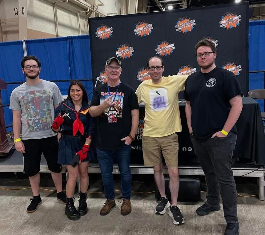 May be an image of 4 people, Superman and text