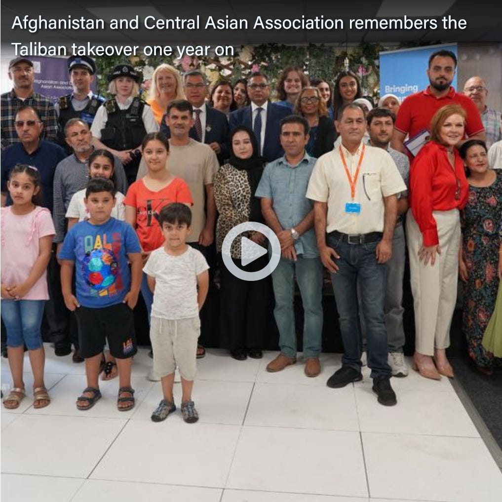 A group of people posing for a photo

Description automatically generated