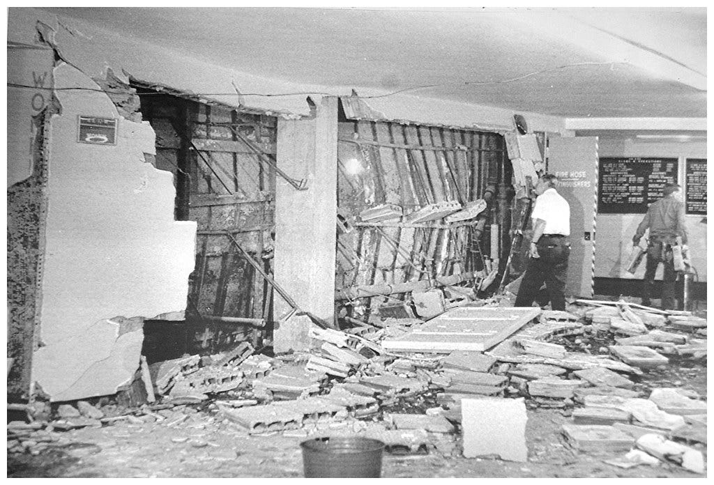 A person standing in a room with debris

AI-generated content may be incorrect.