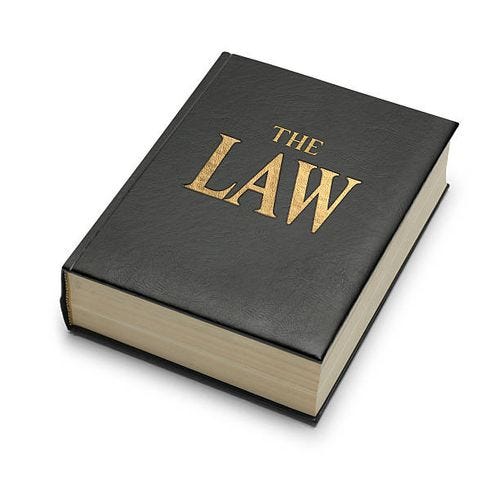 book imprinted with the title "the law" - law book stock pictures, royalty-free photos & images