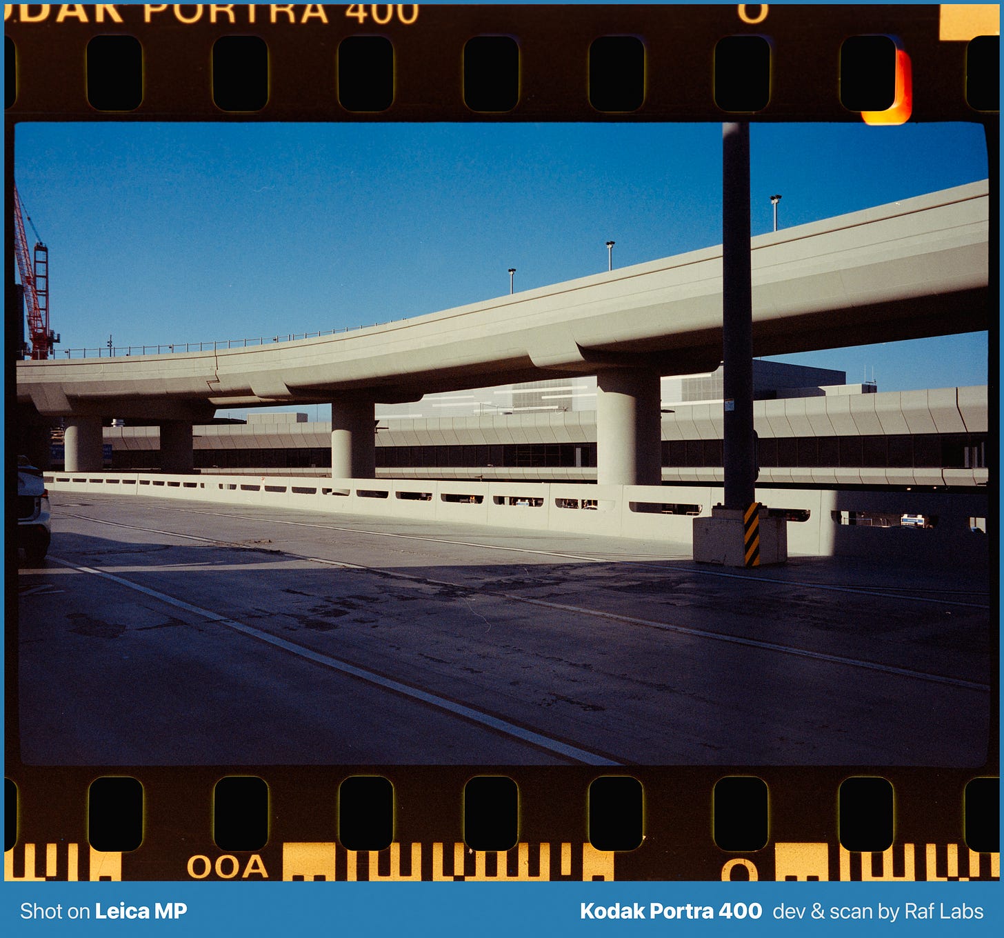 Airport climbing up a San Francisco hillside under clear blue California sky, shot on Kodak Portra 400 film