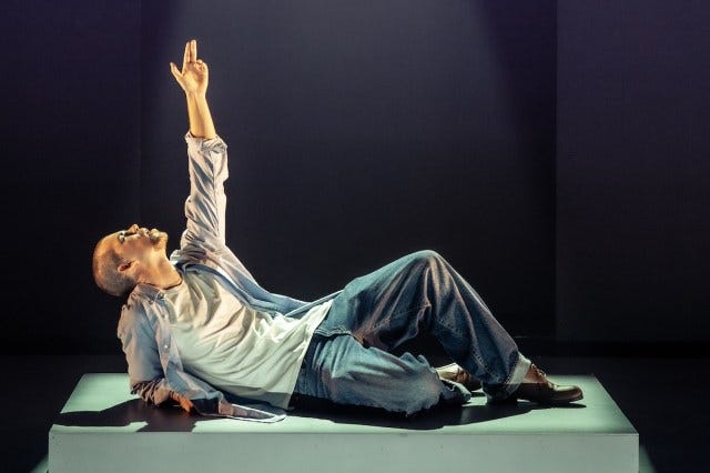 Luke Newton as Alexander McQueen striking a dramatic pose Luke Newton as Alexander McQueen striking a dramatic pose