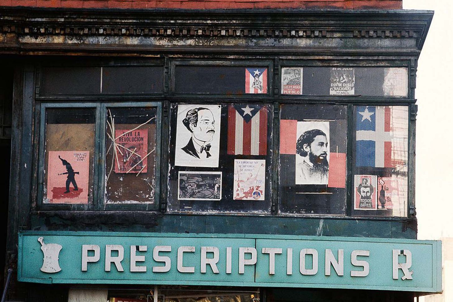 Shoppers walk past old, faded shop signs, reflecting the changing commercial landscape of 1970s NYC. Shoppers walk past old, faded shop signs, reflecting the changing commercial landscape of 1970s NYC.