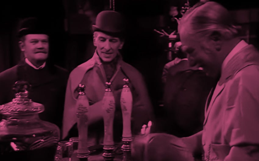 Sherlock Holmes and Dr Watson at the bar of The Alpha Inn.