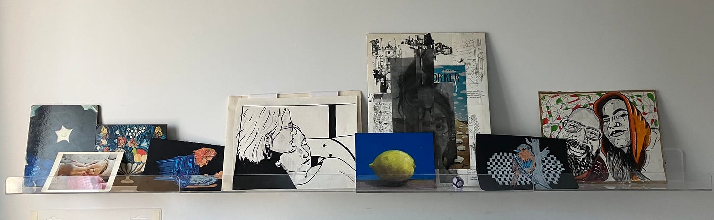 acrylic ledge lined with images of flowers, drawings of mother and daughter, father and daughter, painted yellow lemon on blue background, and collage of New Yorker cartoons with black and white photo superimposed.