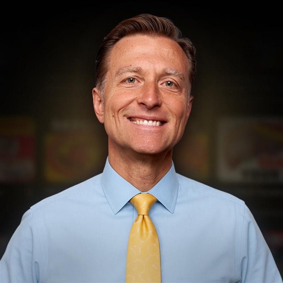 Headshot of Dr. Eric Berg smiling, wearing a light blue dress shirt and yellow tie against a dark background. Headshot of Dr. Eric Berg smiling, wearing a light blue dress shirt and yellow tie against a dark background.