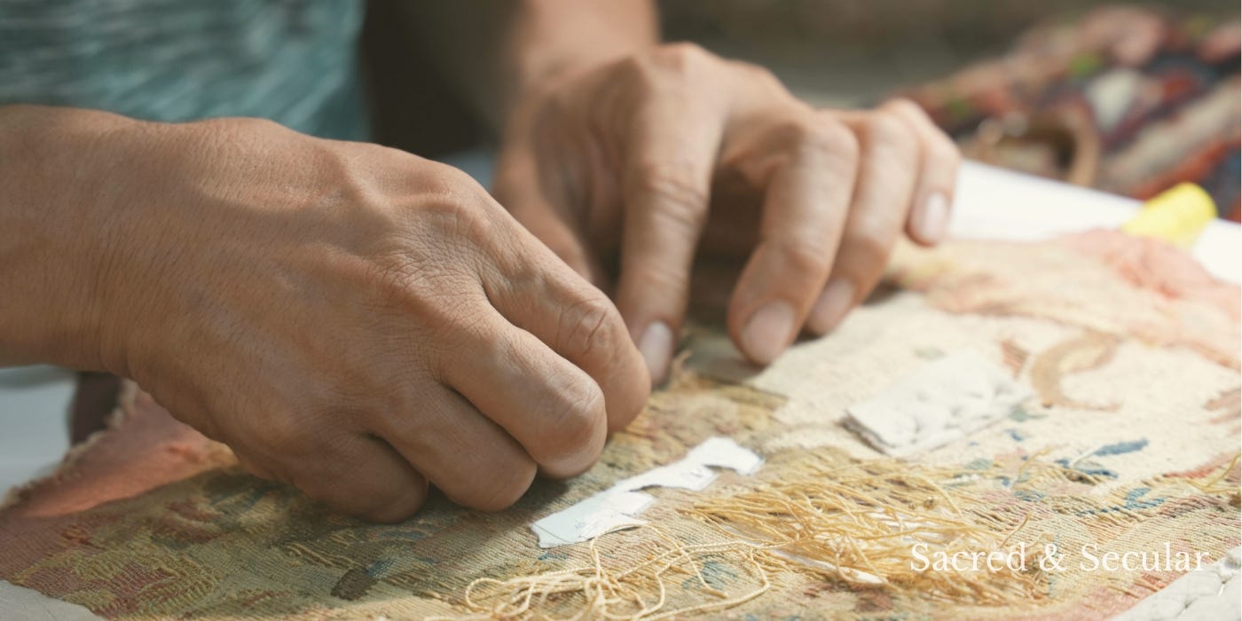 Close-up of hands carefully sewing and mending patterned fabric in soft natural light, emphasising quiet, skilled, and practical work. Close-up of hands carefully sewing and mending patterned fabric in soft natural light, emphasising quiet, skilled, and practical work.