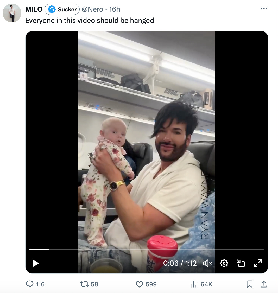 Text: everyone in this video should be hanged/ image: nice looking gay man holding a cute baby Text: everyone in this video should be hanged/ image: nice looking gay man holding a cute baby