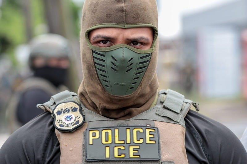 A U.S. Immigration and Customs Enforcement officer watches a crowd of protesters at Delaney Hall, a detention center, in Newark, New Jersey, on May 25, 2026. Employing new tactics, ICE arrested more people in July than in any previous month of the Trump administration. (Photo by Ben Ackman/New Jersey Monitor) A U.S. Immigration and Customs Enforcement officer watches a crowd of protesters at Delaney Hall, a detention center, in Newark, New Jersey, on May 25, 2026. Employing new tactics, ICE arrested more people in July than in any previous month of the Trump administration. (Photo by Ben Ackman/New Jersey Monitor)