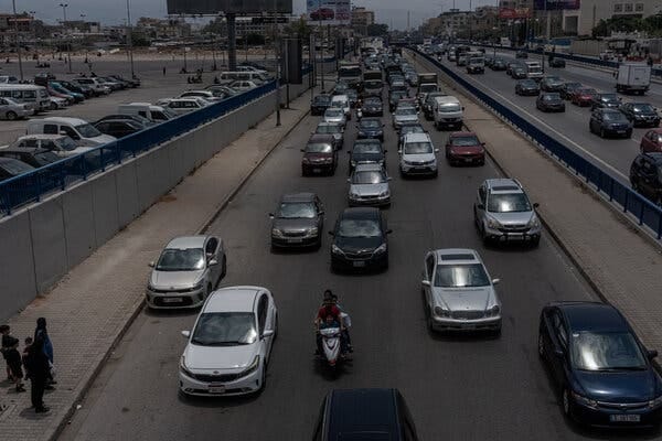 Lines of traffic on a highway. Lines of traffic on a highway.