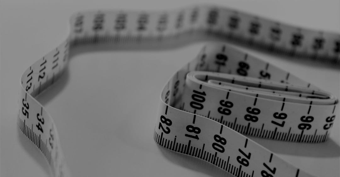 selective focus photography of tape measure selective focus photography of tape measure